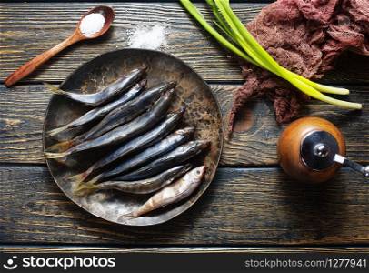 preparation of raw smelt fish, raw smelt fish on plate
