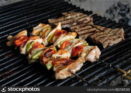preparation of shish kebab, chicken meat skewers and beef liver