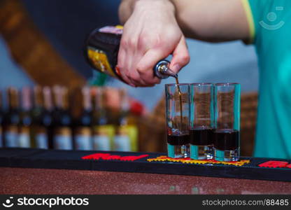 Preparation of shots cocktails. Close-up