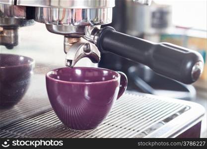 Prepares espresso in coffee shop, stock photo