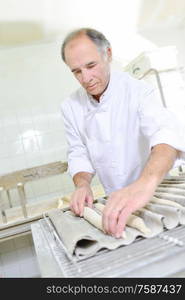 Preparing baguettes for the oven