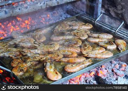 Preparing delicious prawns grilled in the restaurant&#xA;