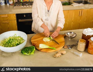 Preparing fermented preserved vegetables. Cabbage kimchi and sauerkraut sour cabbage.