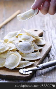 Preparing fresh ravioli at the kitchen table.