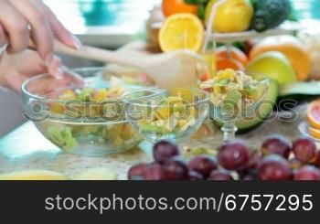 preparing fruit salad in the kitchen