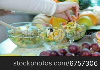 preparing fruit salad in the kitchen