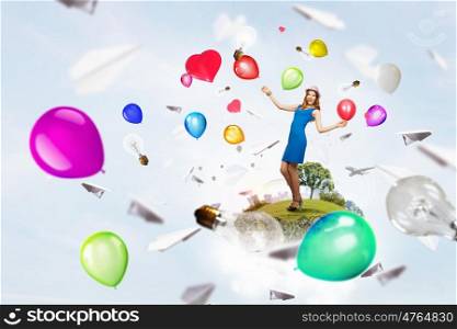 Preparing great party. Young woman in casual with colorful balloons celebrating