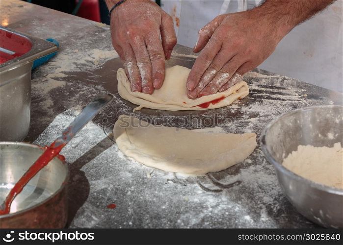 Preparing Italian Stuffed Calzone Dough: Food Theme. Preparing Italian Stuffed Calzone Dough