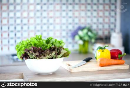 Preparing of Green Salad in domestic kitchen