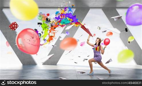 Preparing office party. Young woman in casual celebrating in office