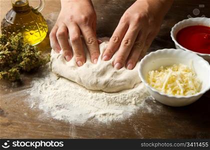 Preparing pizza dough
