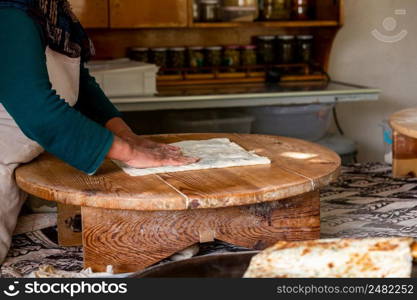 Preparing the cooked pancake for service by cutting it in Antalya Turkey