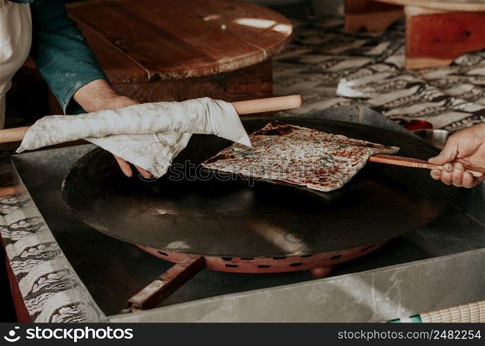 Preparing the cooked pancake for service by cutting it in Antalya Turkey