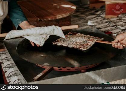 Preparing the cooked pancake for service by cutting it in Antalya Turkey