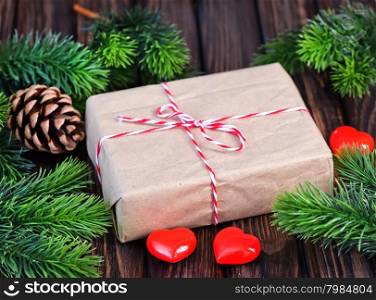 present with ribbon on the wooden table