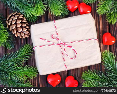 present with ribbon on the wooden table