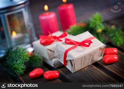present with ribbon on the wooden table