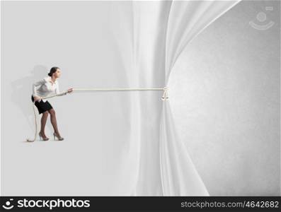 Presentation of ideas. Young businesswoman pulling curtain with rope. Place for text