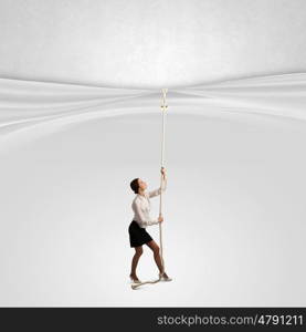 Presentation of ideas. Young businesswoman pulling curtain with rope. Place for text