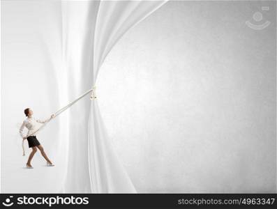 Presentation of ideas. Young businesswoman pulling curtain with rope. Place for text