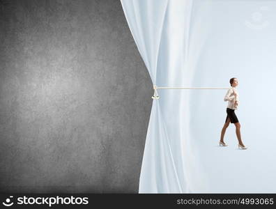 Presentation of ideas. Young businesswoman pulling curtain with rope. Place for text