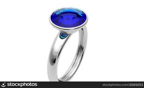 Presentation of platinum ring with blue diamond