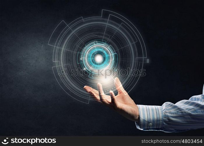 Presenting digital technologies. Close up of businessman holding media concept in palms