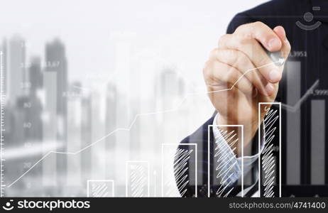 Presenting growth strategy. Close up of businessman drawing increasing graph with marker on media screen