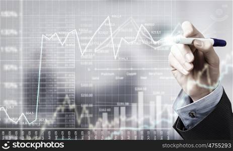 Presenting growth strategy. Close up of businessman drawing increasing graph with marker on media screen