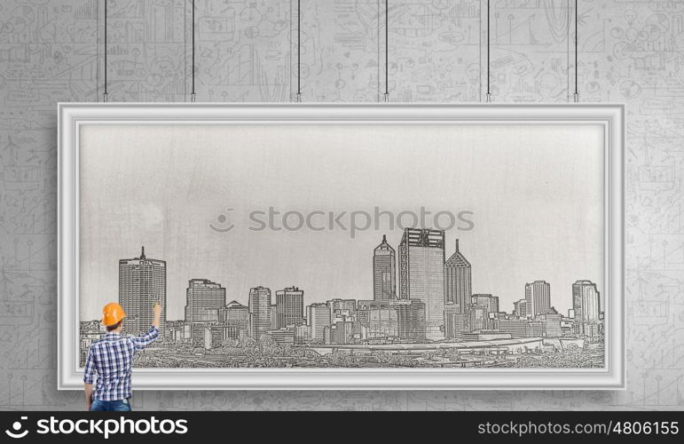 Presenting ideas. Rear view of businessman drawing business plan on white banner