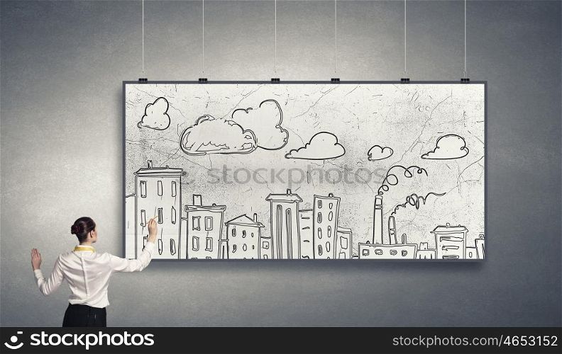 Presenting ideas. Rear view of businesswoman drawing business plan on white banner