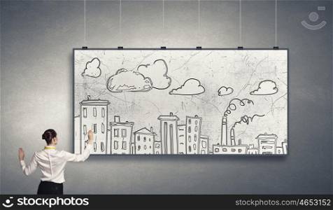 Presenting ideas. Rear view of businesswoman drawing business plan on white banner