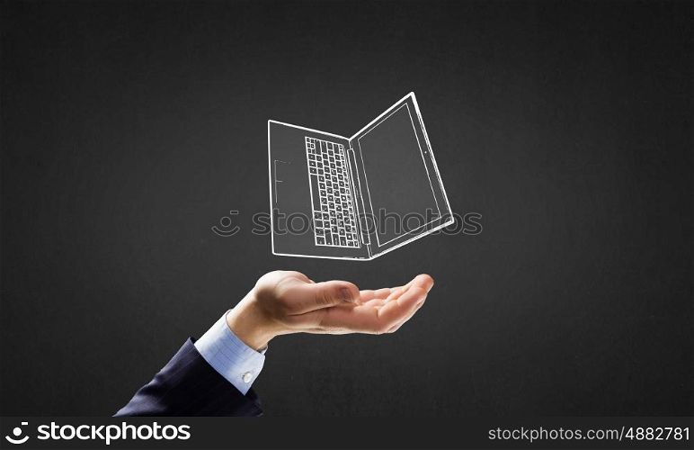 Presenting laptop. Human hand holding in palm laptop symbol