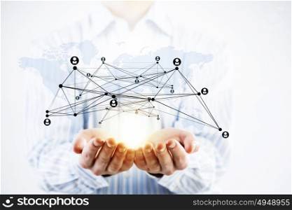 Presenting social net concept. Close up of businessman demonstrating in palm network concept