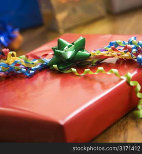 Presents wrapped and decorated with bows on a table.