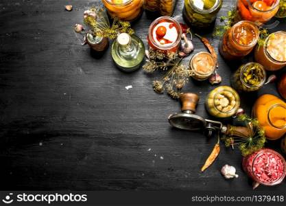 Preserves mushrooms and vegetables with seamer. On the black chalkboard.. Preserves mushrooms and vegetables with seamer.
