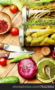 Preserves vegetables in glass jars.Various canned vegetables. Assortment of pickled vegetable