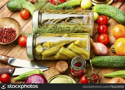 Preserves vegetables in glass jars.Various canned vegetables. Jars of pickled vegetables