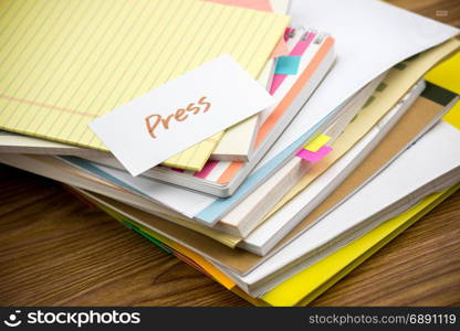 Press; The Pile of Business Documents on the Desk