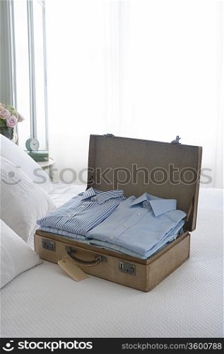 Pressed shirts in a suitcase