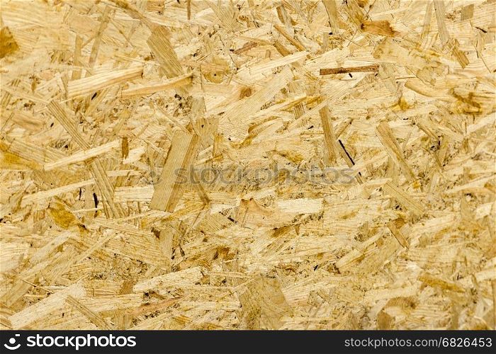 Pressed wooden panel background seamless texture of oriented strand board - OSB. texture OSB