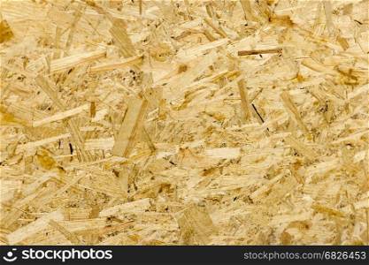 Pressed wooden panel background seamless texture of oriented strand board - OSB. texture OSB