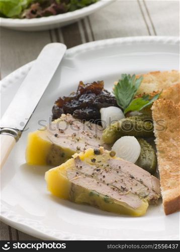 Pressing of Foie Gras and Green Peppercorns with Cornichons Brioche and Onion Confit