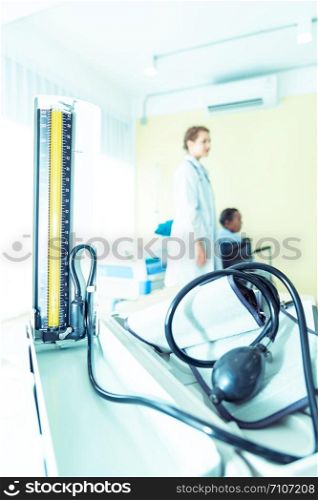 Pressure instrument for healthcare and medical with doctor and patient for blurred background.
