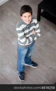 Preteen boy standing at home seen from above
