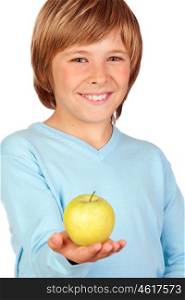 Preteen boy with a yellow apple isolated on white background