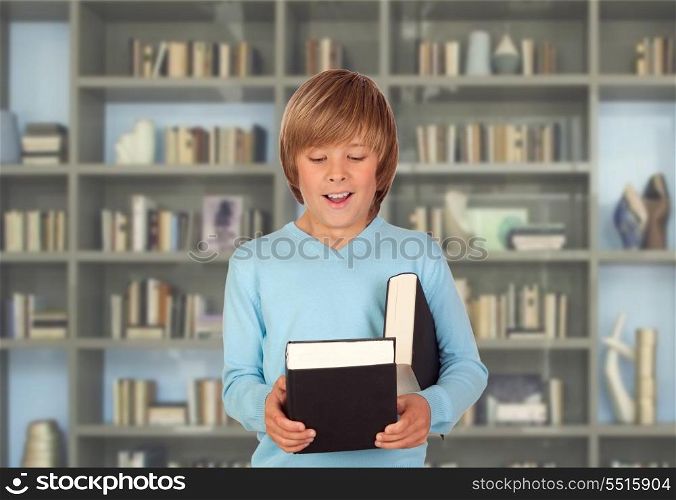 Preteen boy with books for reading in the library