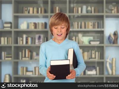 Preteen boy with books for reading in the library
