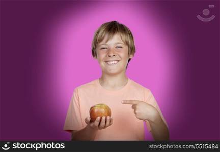 Preteen with a red apple on purple background