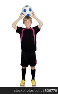 Preteen with a uniform for play soccer holding a ball isolated on white background